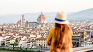 Young female tourist looking on the old town of Florence